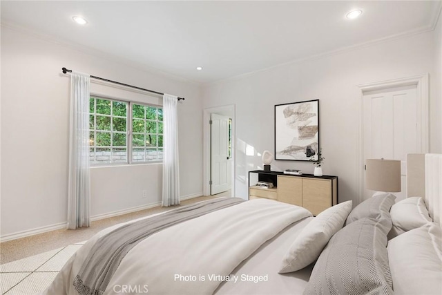 carpeted bedroom with ornamental molding