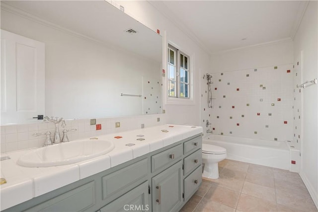 full bathroom with shower / bathing tub combination, tile patterned flooring, ornamental molding, vanity, and toilet