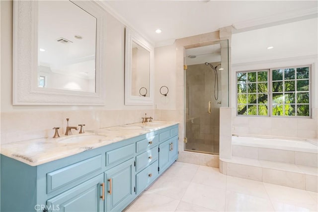 bathroom featuring vanity, tile patterned flooring, and shower with separate bathtub