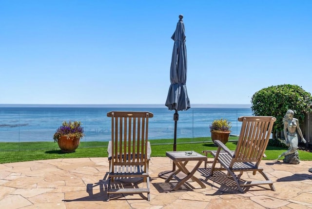 view of patio / terrace with a water view