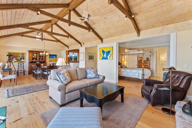 living room with wood ceiling, track lighting, light hardwood / wood-style floors, ceiling fan with notable chandelier, and beamed ceiling