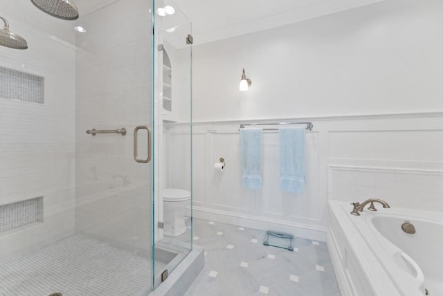 bathroom with toilet, separate shower and tub, and tile patterned flooring