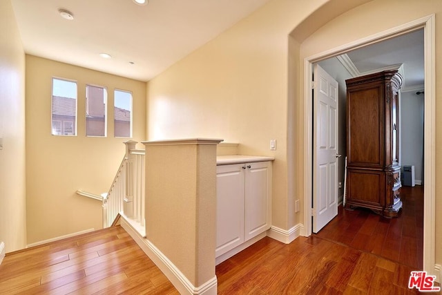 hall with hardwood / wood-style flooring