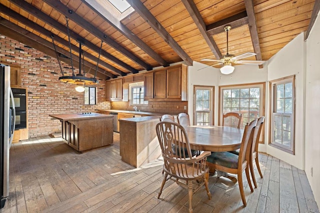 unfurnished dining area with wooden ceiling, beamed ceiling, and hardwood / wood-style floors