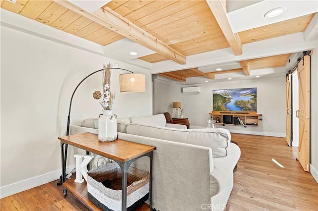 living room featuring wooden ceiling, a barn door, beamed ceiling, and light hardwood / wood-style flooring