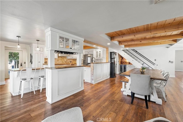 12475 Christmas Tree Rd, Ojai, CA 93023 - living room with wood ceiling, dark wood-type flooring, beamed ceiling, and stairs