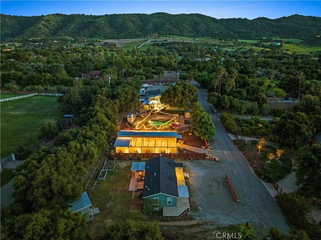 birds eye view of property featuring a mountain view