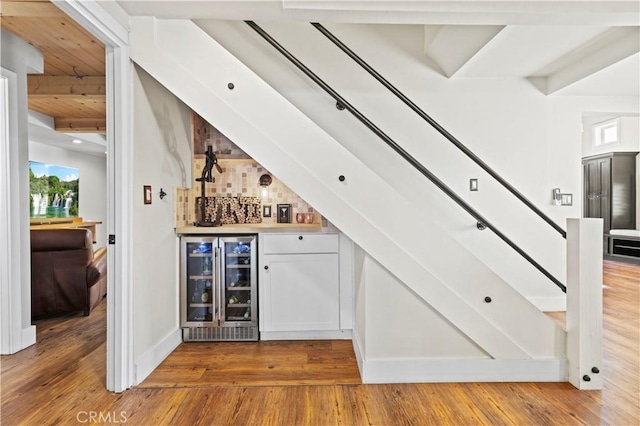 12475 Christmas Tree Rd, Ojai, CA 93023 - bar featuring a dry bar, wood finished floors, wine cooler, and beamed ceiling