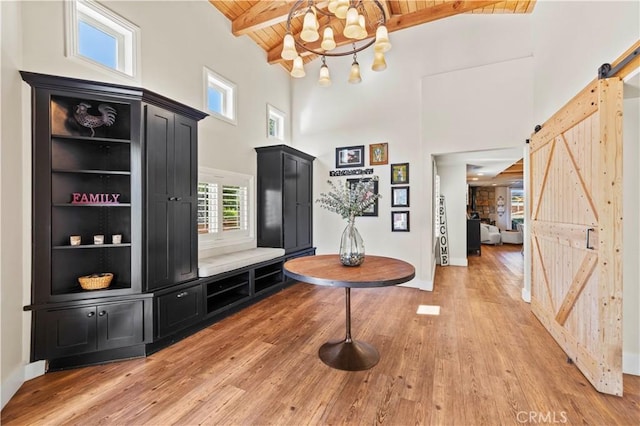 12475 Christmas Tree Rd, Ojai, CA 93023 - foyer featuring wooden ceiling, a barn door, a notable chandelier, and light wood-type flooring