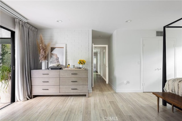 bedroom featuring light wood-type flooring