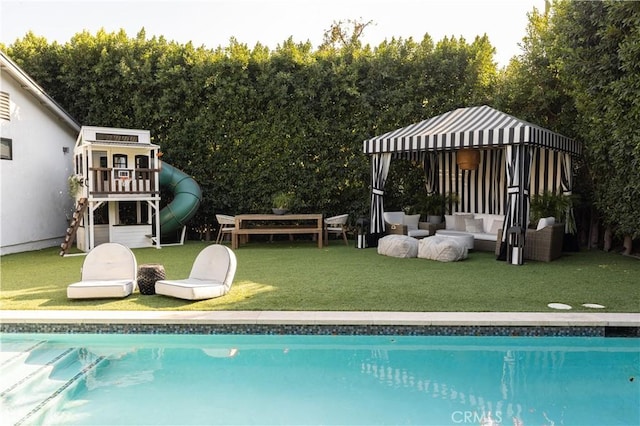 view of pool featuring a yard and an outdoor hangout area