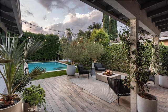 view of pool featuring a fire pit