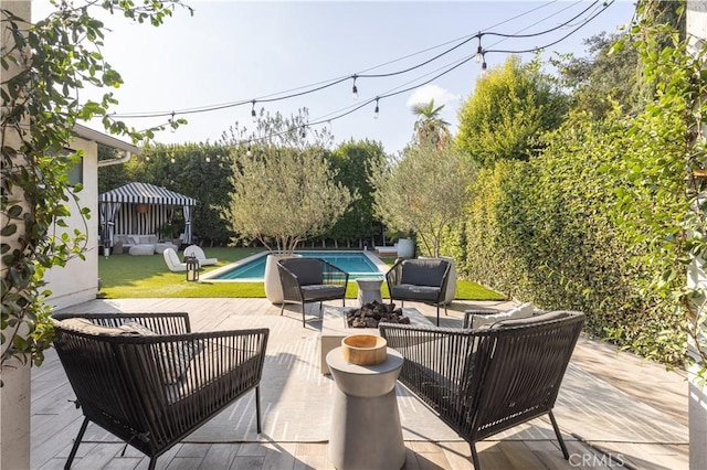 view of patio featuring a gazebo and outdoor lounge area