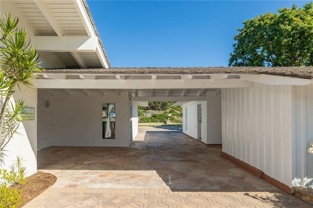 exterior space with a carport