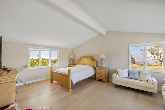 bedroom featuring lofted ceiling with beams and light wood-type flooring