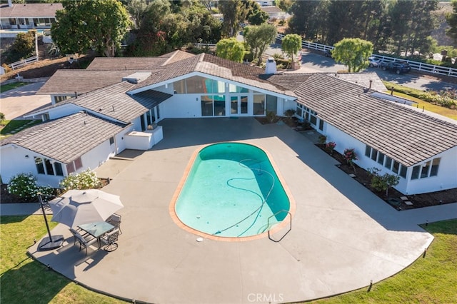 view of swimming pool with a patio area