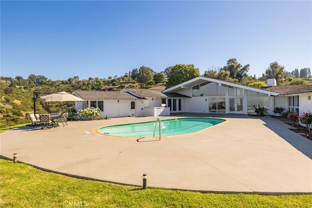 view of pool featuring a patio area