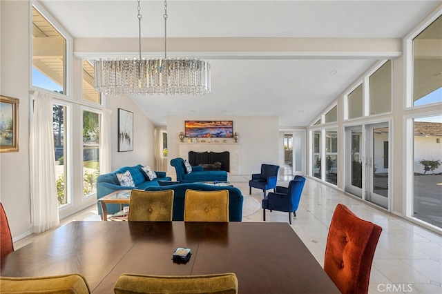 tiled dining space featuring a high ceiling, expansive windows, and a chandelier