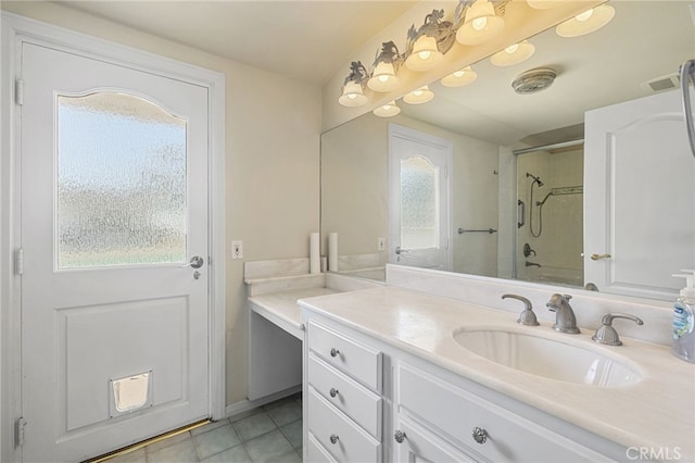 bathroom featuring tile patterned flooring, vanity, and bathing tub / shower combination