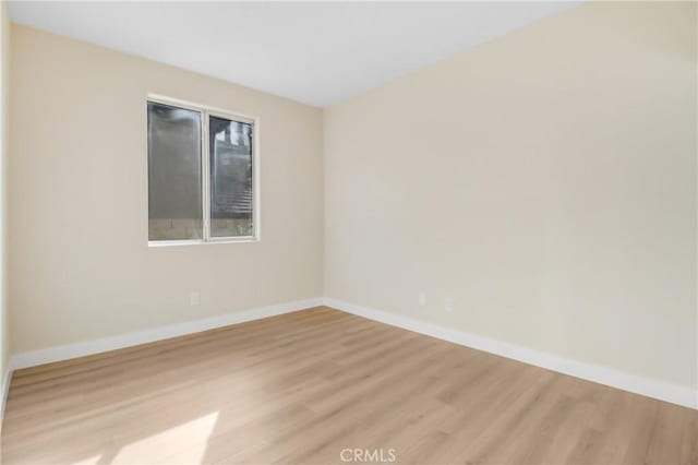 spare room featuring light hardwood / wood-style flooring