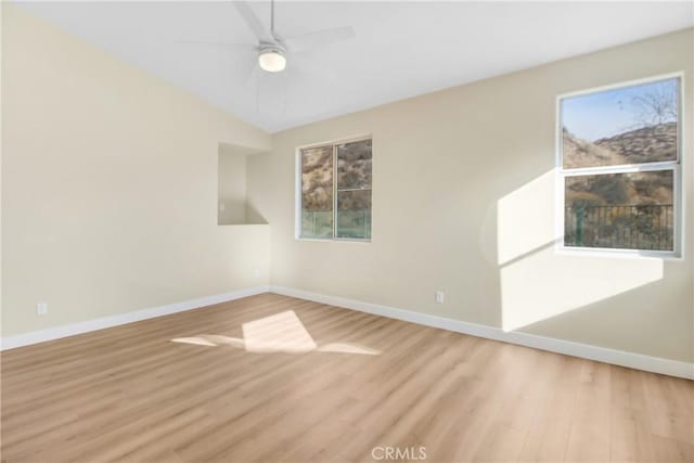 spare room featuring light wood-type flooring and ceiling fan