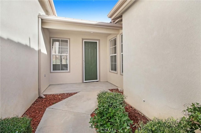 doorway to property featuring a patio area