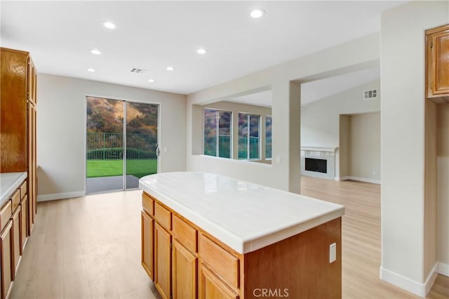 kitchen featuring light hardwood / wood-style flooring and a kitchen island