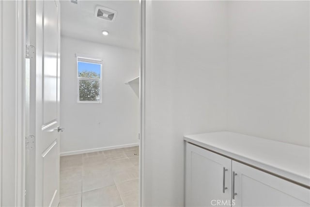 bathroom with tile patterned floors