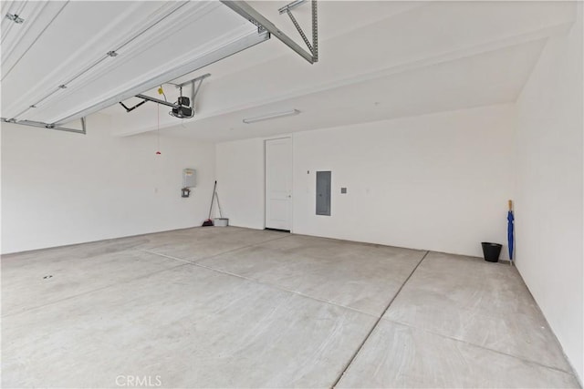 garage featuring electric panel and a garage door opener