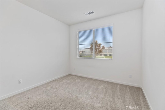 unfurnished room featuring carpet