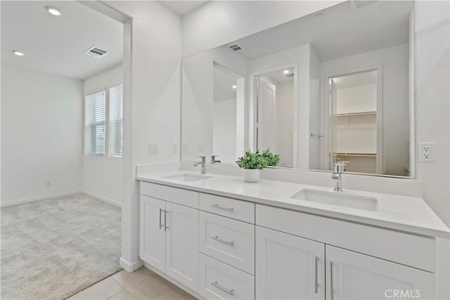 bathroom with vanity and tile patterned floors