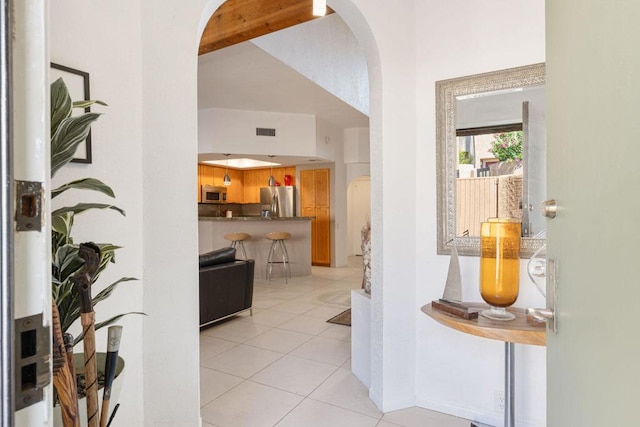 hallway featuring light tile patterned flooring