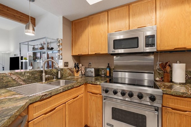 kitchen with sink, appliances with stainless steel finishes, and beamed ceiling