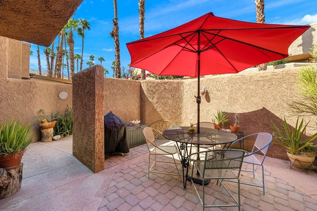 view of patio featuring a grill