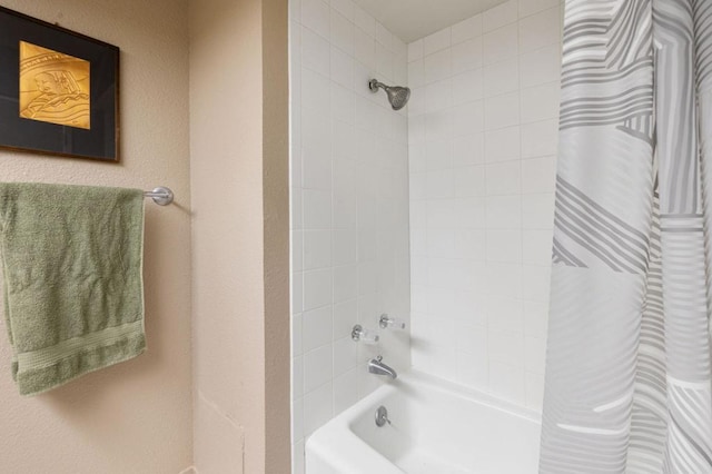 bathroom with shower / bath combination with curtain