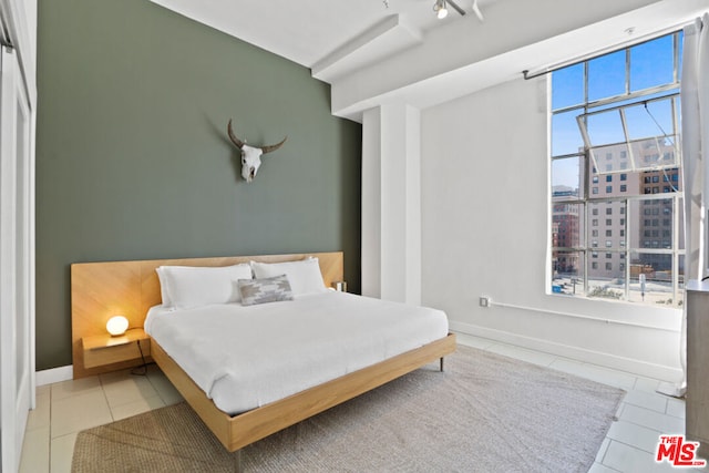 bedroom with tile patterned floors