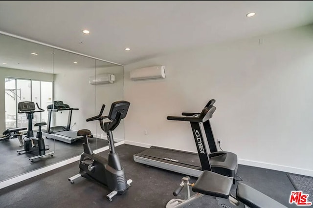 workout area featuring an AC wall unit