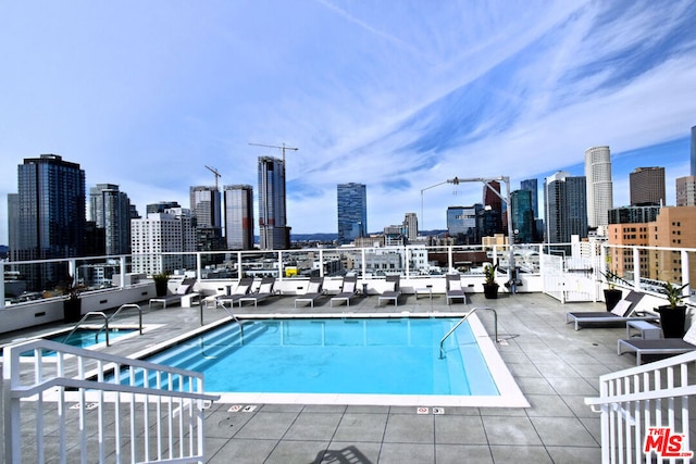 view of swimming pool featuring a patio area