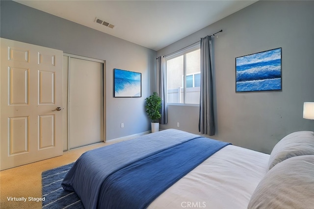 carpeted bedroom featuring a closet