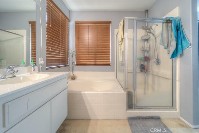 bathroom with shower with separate bathtub and vanity