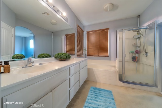 bathroom featuring vanity and separate shower and tub