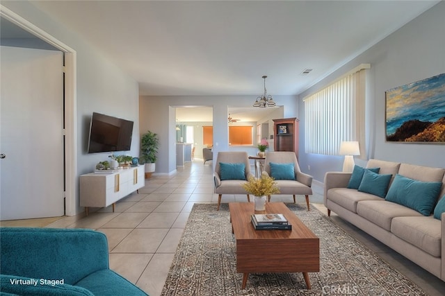 living room featuring an inviting chandelier and light tile patterned flooring