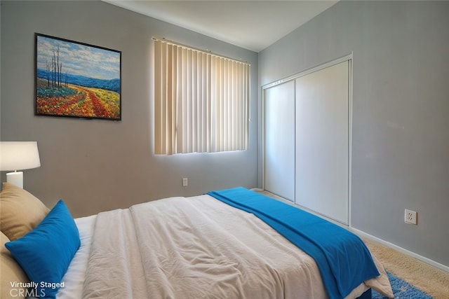 carpeted bedroom with a closet