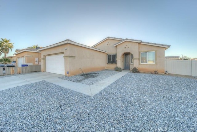 view of front of property featuring a garage