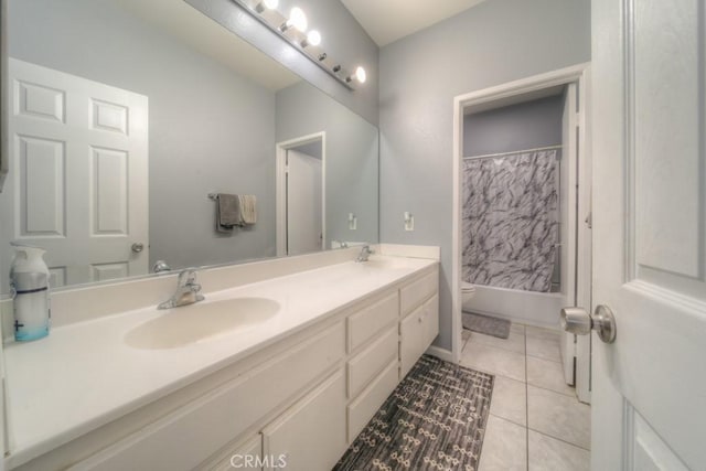 full bathroom featuring toilet, tile patterned flooring, vanity, and shower / tub combo with curtain