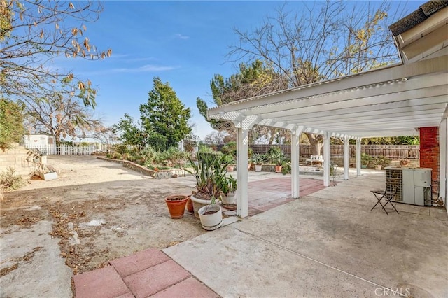 view of patio / terrace with central AC unit and a pergola