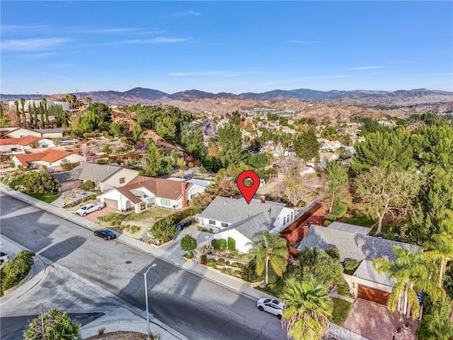 birds eye view of property with a mountain view