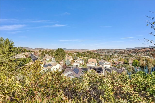 birds eye view of property with a mountain view