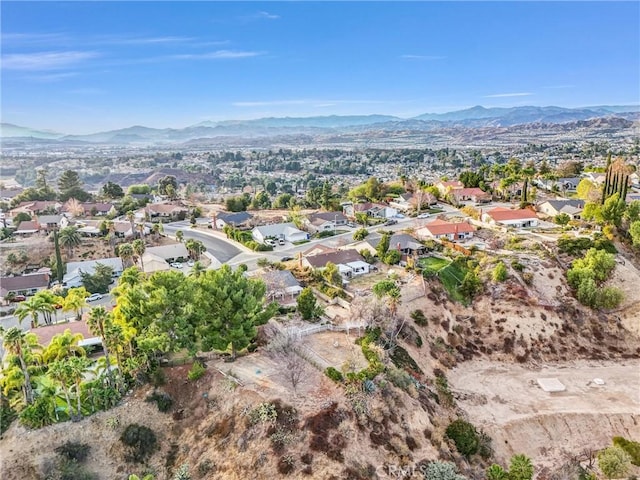 birds eye view of property with a mountain view