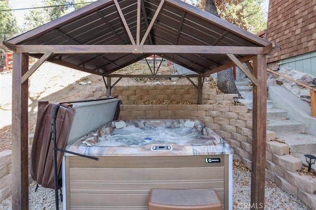 view of patio / terrace with a gazebo and a hot tub